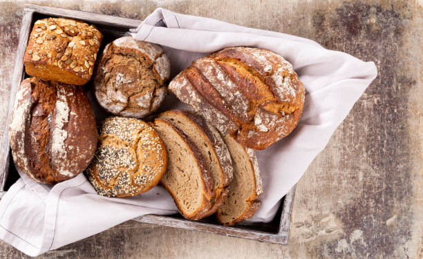 istock Sliced rye bread on cutting board, closeup. 1368359388