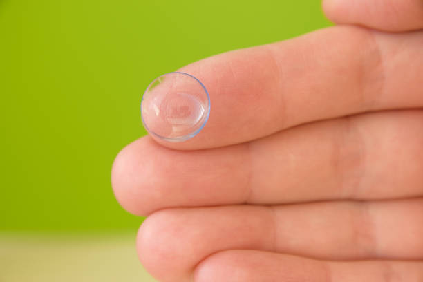 istock Contact lens on fingertip. 1368360328