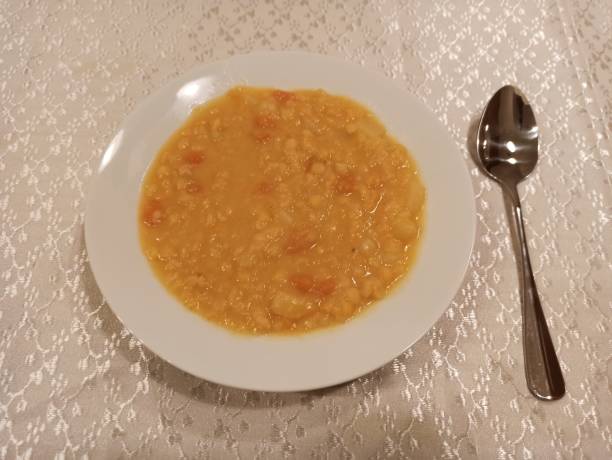 Traditional vegan soup with lentile potato onion and carrot in glasgow Scotland england uk