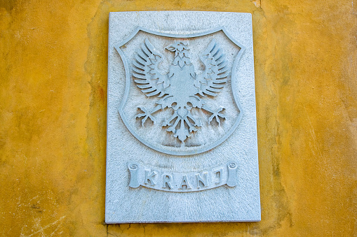 Coat of arms of Kranj, Slovenia on wall of City Hall.