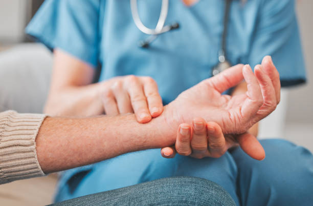 Shot of a nurse checking the pulse of her elderly patient Have you been under stress taking pulse stock pictures, royalty-free photos & images