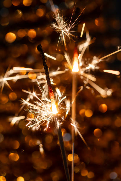 istock Christmas bengal fire sparkles against the black background. 1368361868