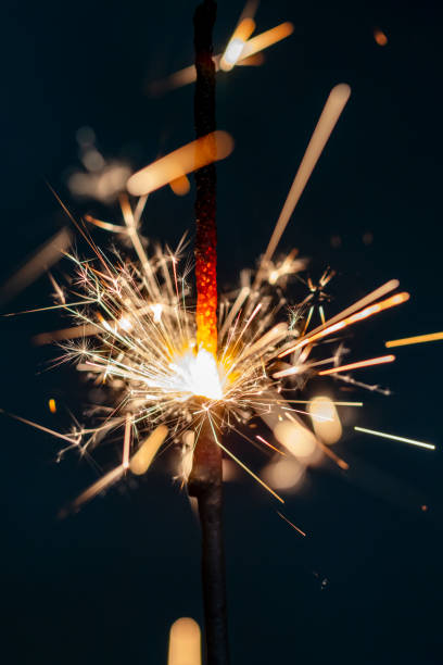 istock Christmas bengal fire sparkles against the black background. 1368361889