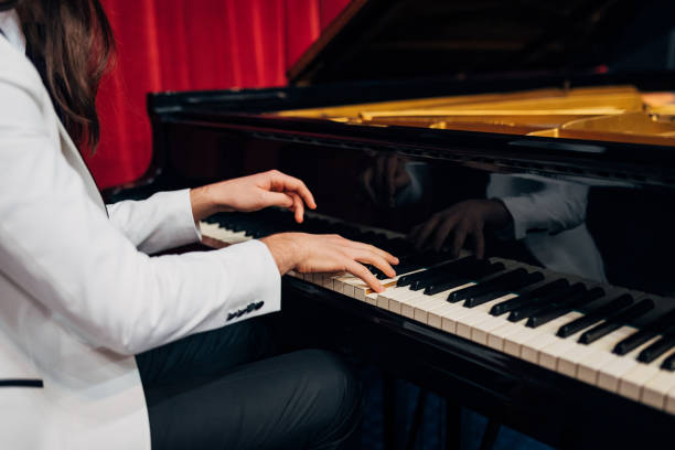 istock Close-up of an unrecognizable pianist practicing his piano skills. 1368363383