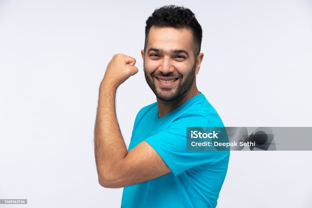 Portrait of Young Men, stock photo Indian, People, Men, One Person, background, lifestyle, Flexing Muscles Stock Photo