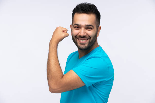 retrato de jovens, foto de estoque - flexing muscles bicep men human arm - fotografias e filmes do acervo