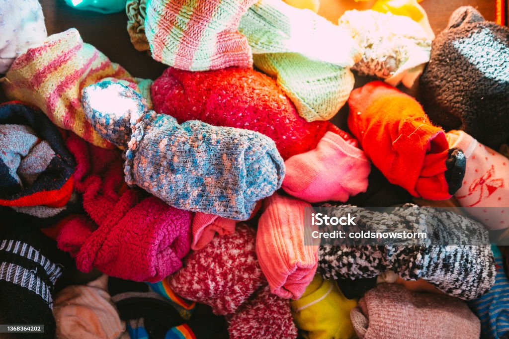 Pile of colorful socks in the drawer Color image depicting a pile of colorful socks in the chest of drawers. Sock Stock Photo