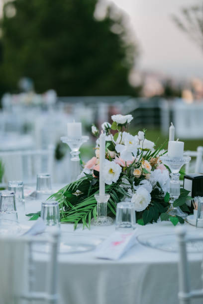 istock table centerpiece with white flowers and candles 1368365142