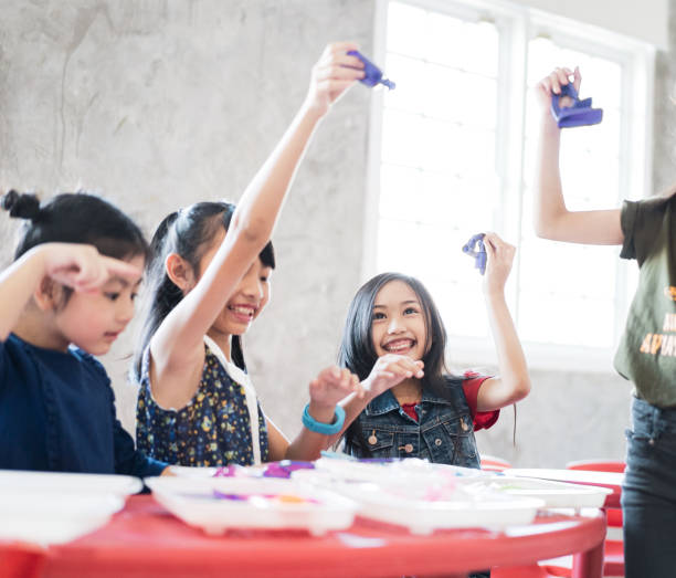 istock Childhood students and friends playing doctor at school class 1368365656