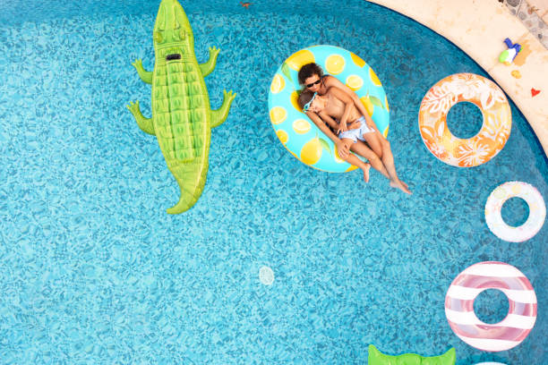Mother with son on inflatable