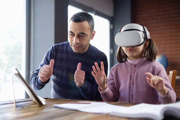 istock Father Assisting Her Daughter Doing Homework Via Metaverse 1368367885