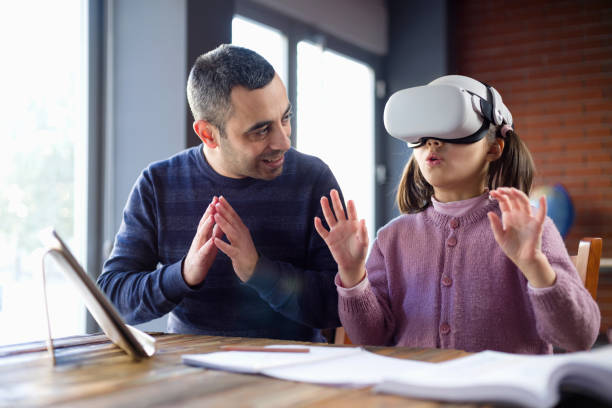 istock Father Assisting Her Daughter Doing Homework Via Metaverse 1368368107