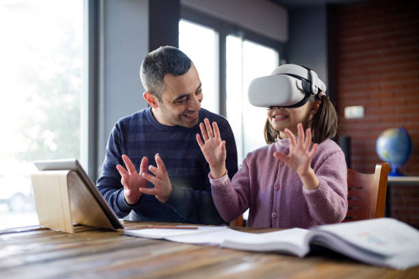 istock Father Assisting Her Daughter Doing Homework Via Metaverse 1368368194