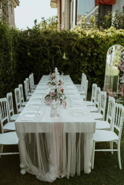 istock white table and center table decoration with colorful flowers 1368368570