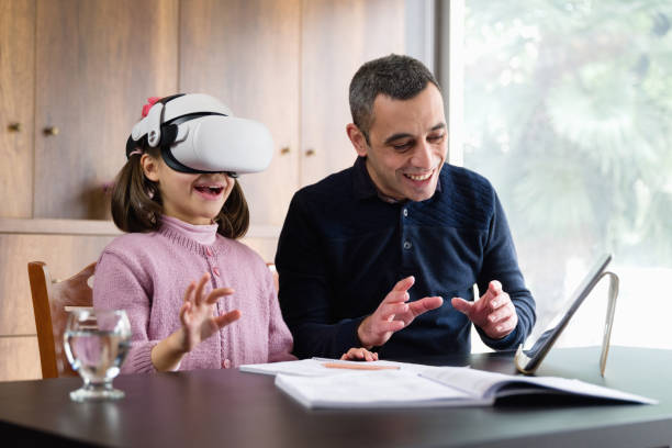 istock Father Assisting Her Daughter Doing Homework Via Metaverse 1368369639