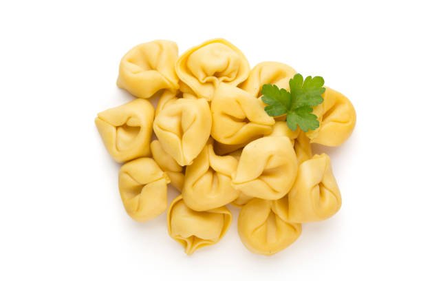 istock Raw homemade pasta,tortellini with herbs. 1368369862