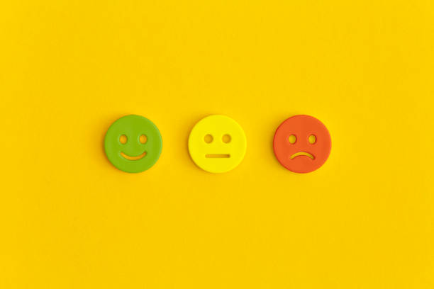 istock Emoticon smile on a yellow background. Customer feedback. 1368369886