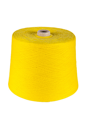 A big spool of yellow sewing thread isolated on white background (with clipping path)