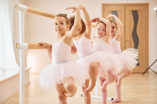 istock Little ballerinas preparing for performance by practicing dance moves 1368371446