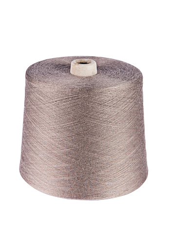 A big spool of brown sewing thread isolated on white background (with clipping path)