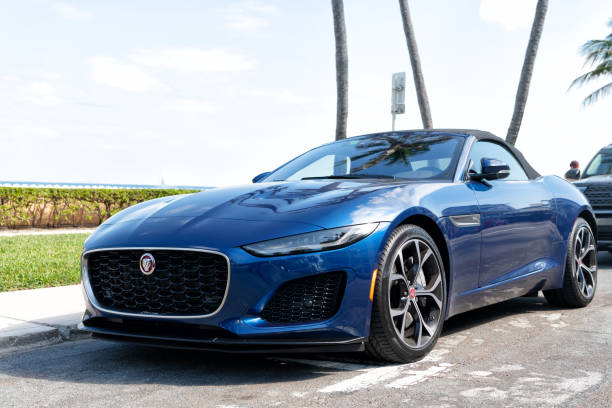 Famously rich sports convertible showing off her leather seats in public