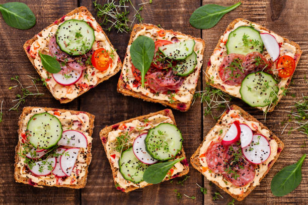 istock Sandwiches with cream cheese, vegetables and salami. 1368373358