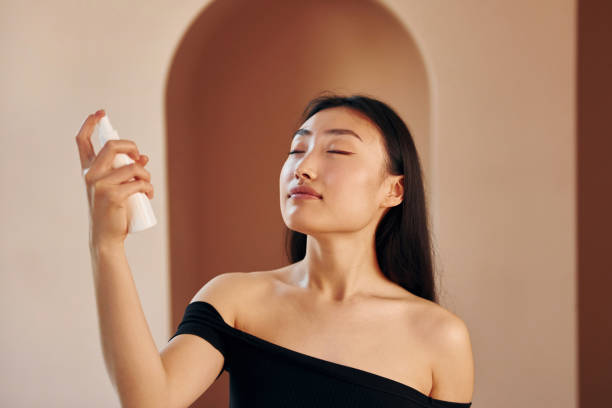 istock Young serious asian woman standing indoors 1368375088
