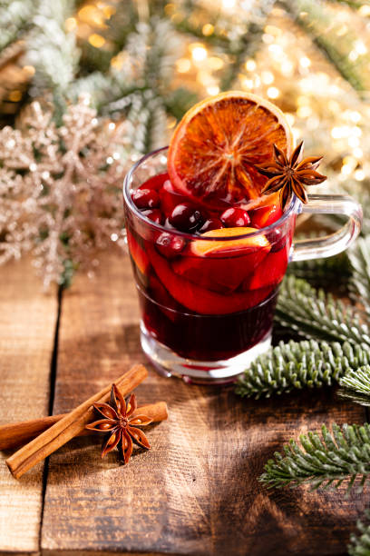 istock Christmas mulled wine with spices on a wooden rustic table. 1368375984