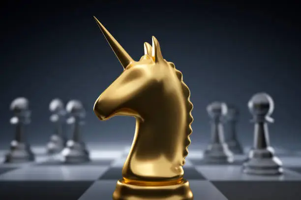 Golden chess unicorn with silver pawns on dark background - 3D illustration