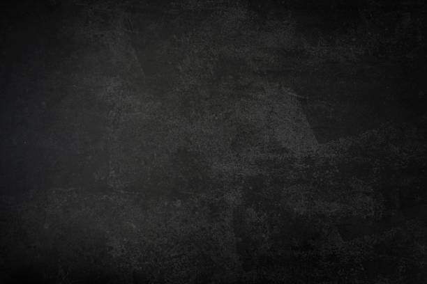 istock Black textured background. Empty space of textured material of black color. Black concrete 1368376737