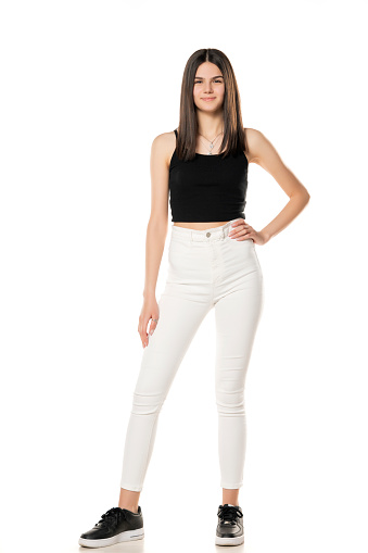 https://media.istockphoto.com/id/1368379213/photo/a-teenage-girl-in-white-jeans-and-a-black-shirt.jpg?b=1&s=170667a&w=0&k=20&c=pWckN8CHntjQySjAAs_3ibdkFno7Xwf5GwN300hEC8o=