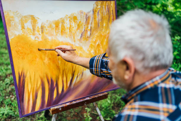 istock Retired man painting on canvas 1368379412