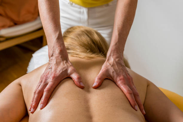 istock woman enjoying therapeutic massage in spa 1368380103