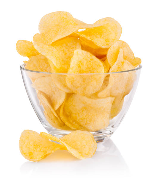 istock Potato chips in glass bowl isolated on white background 1368384637