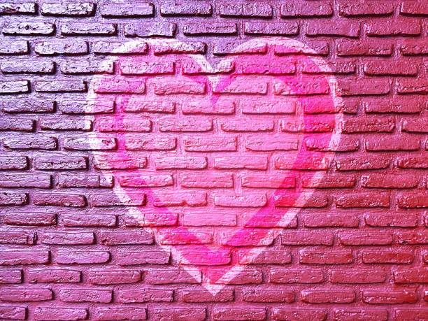 istock old brick wall graffiti heart, valentines day background 1368387407