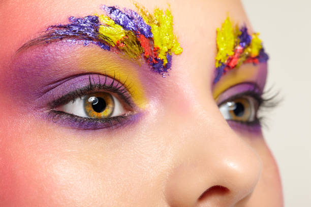 istock Close-up female portrait with unusual face art make-up. 1368389615