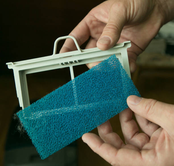 Close-up of a clean filter diffuser of a wet cleaning vacuum cleaner. Installing the filter before cleaning Close-up of a clean filter diffuser of a wet cleaning vacuum cleaner. Installing the filter before cleaning. n11 stock pictures, royalty-free photos & images