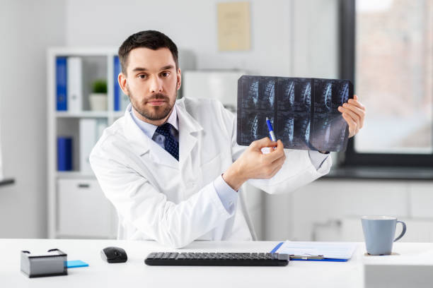 istock doctor with x-ray having video call at clinic 1368392857