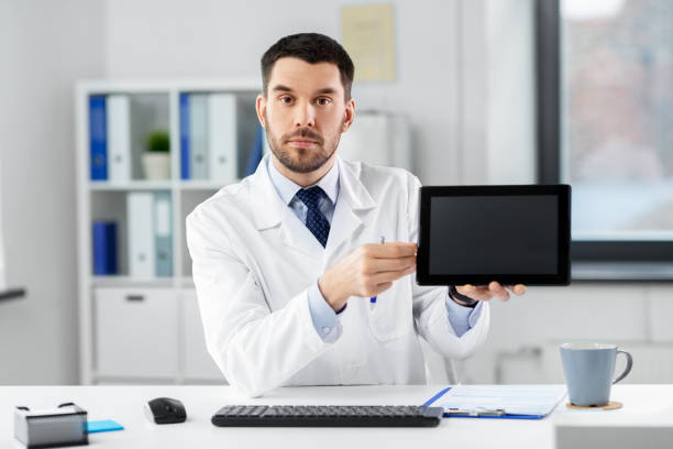 istock doctor with tablet pc having video call at clinic 1368394363