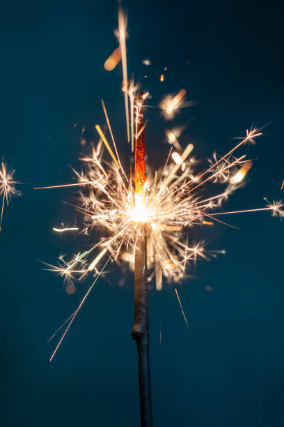 istock Christmas bengal fire sparkles against the black background. 1368395563