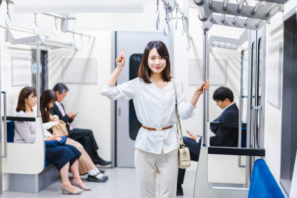 istock Young woman pointing at a point on the train 1368396210