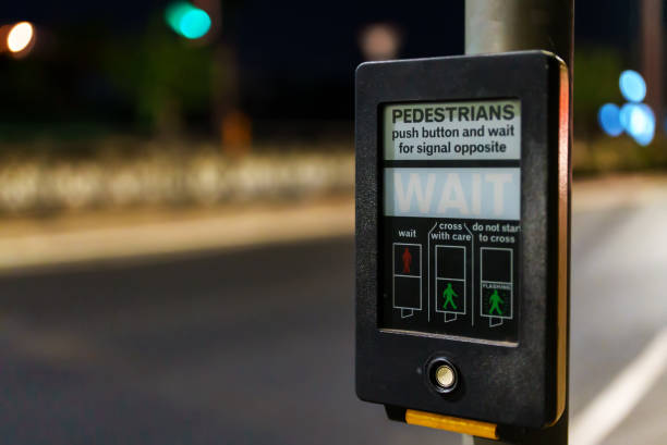 istock Modern pedestrian crossing button device on the street. 1368396406