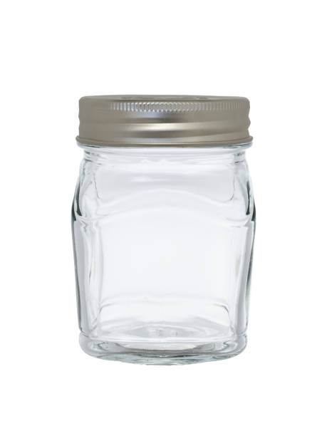 istock Empty transparent, glass jar for storage. Isolated on a white background, closed with a metal lid 1368397289