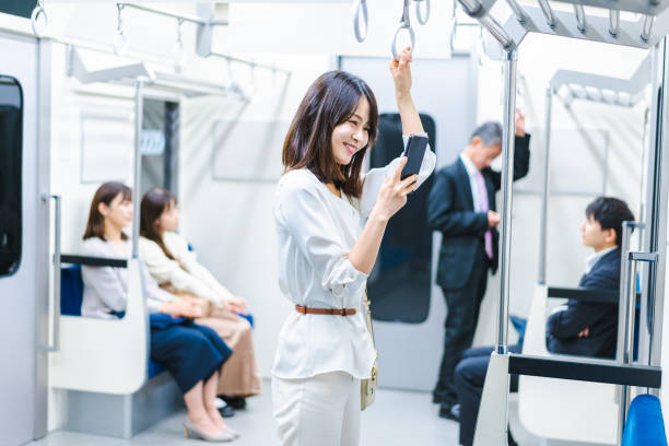 istock A young woman using her smartphone on the train 1368397399
