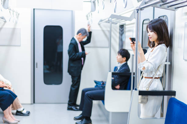 istock A young woman using her smartphone on the train 1368397408