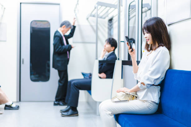 istock A young woman using her smartphone on the train 1368397422