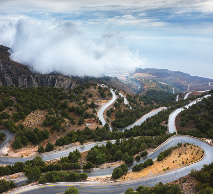 Aerial view on winding mountain road in south Chania region (Crete, Greece).