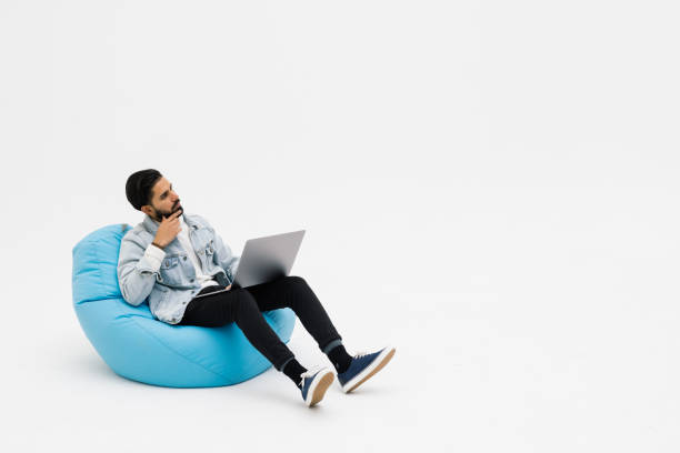 istock Young unhappy upset businessman on video call meeting speaking about work problems on white background 1368398147