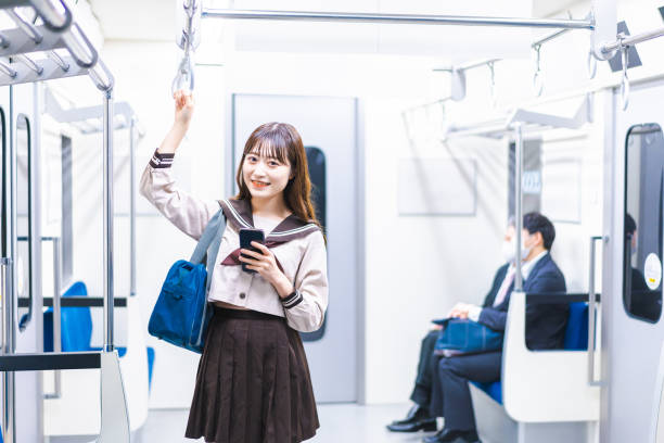 istock High school girls commuting to school by train 1368399010