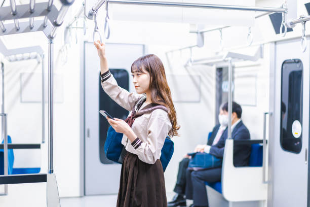 istock High school girls commuting to school by train 1368399016